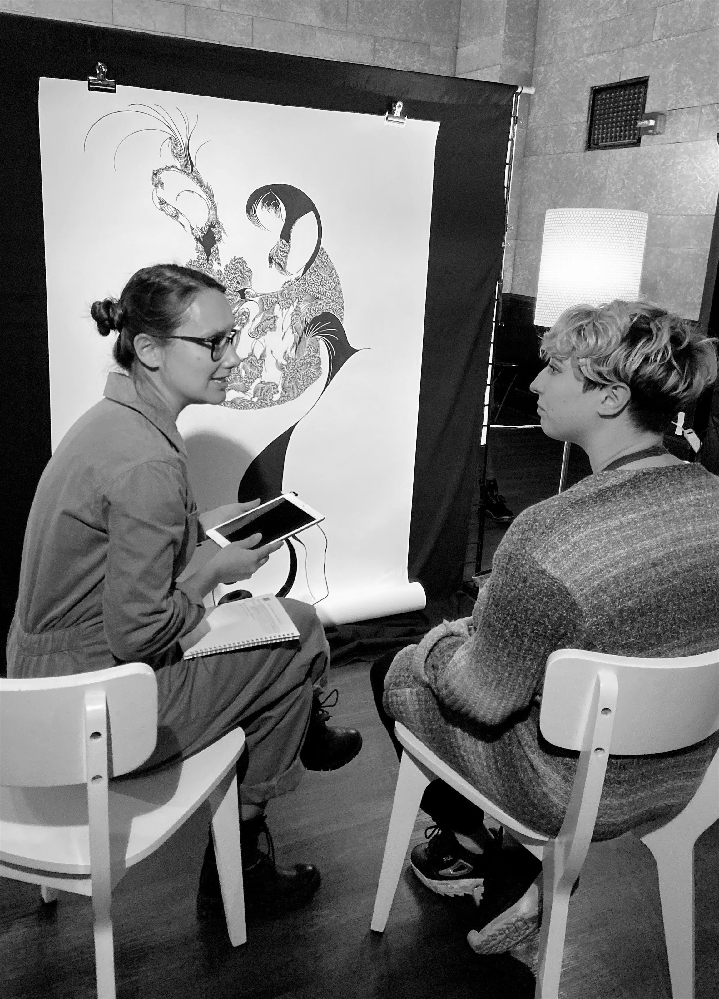 a group of people sitting at a desk